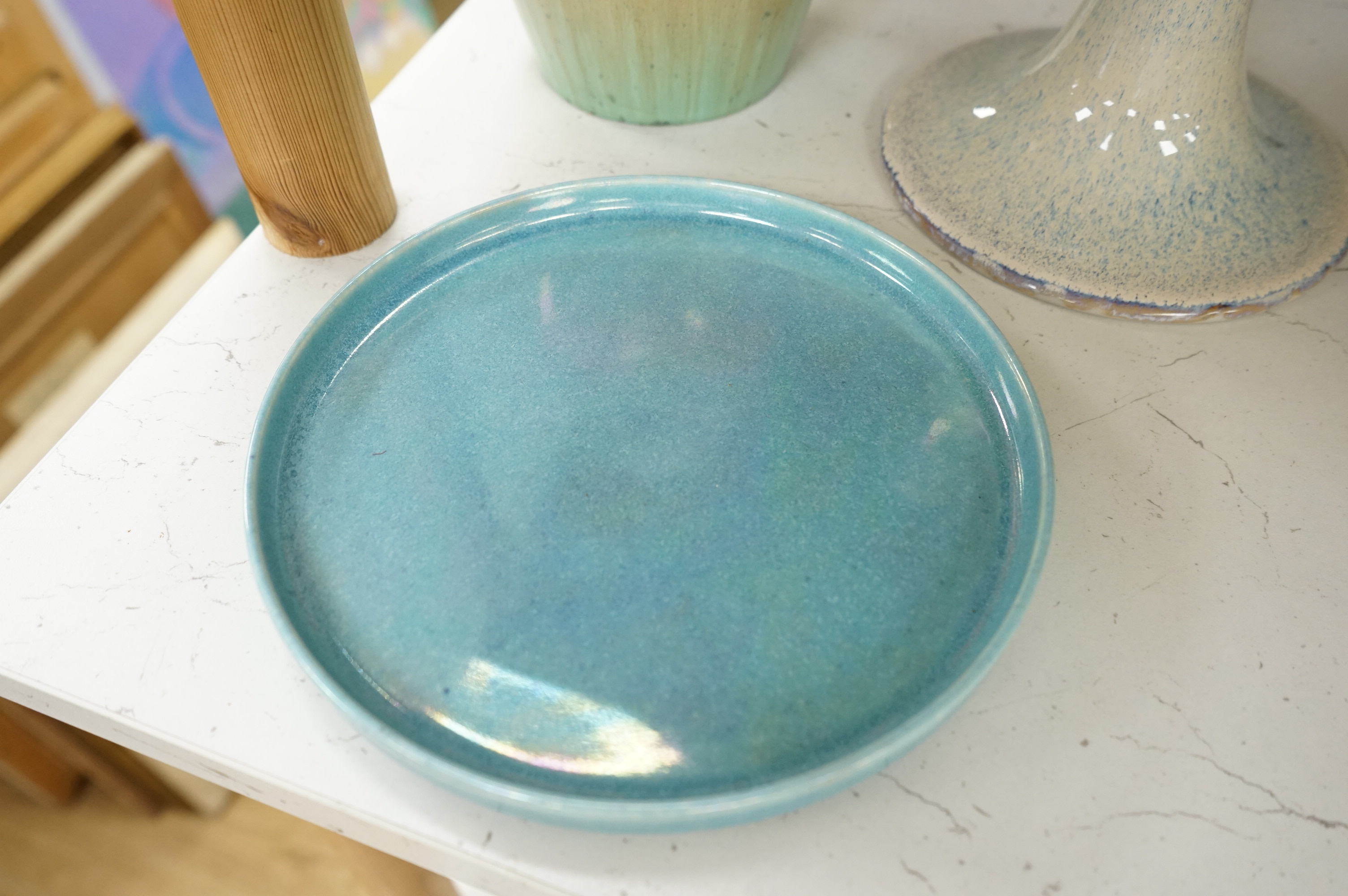 A Ruskin souffle glazed vase, impressed 1932, a Ruskin circular dish and an earthenware candlestick, tallest 21cm (3)